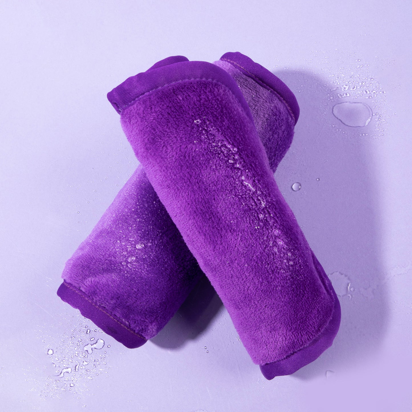 Two Queen Purple Makeup Eraser cloths.
