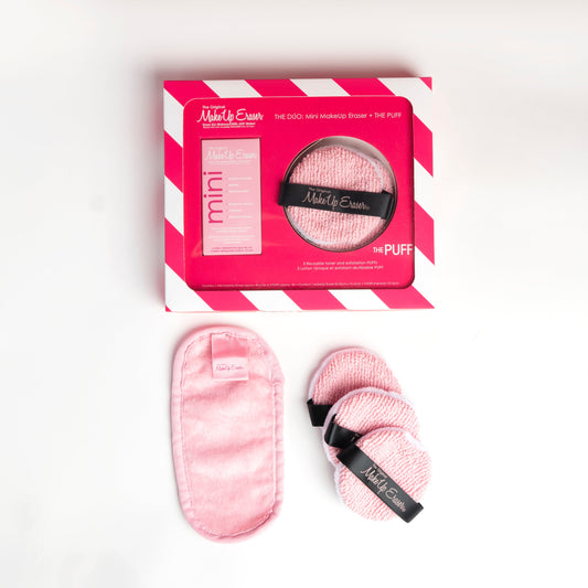 THE DUO: Mini MakeUp Eraser + THE PUFF packaging next to Mini Pink MakeUp Eraser cloth and The PUFF cloths.