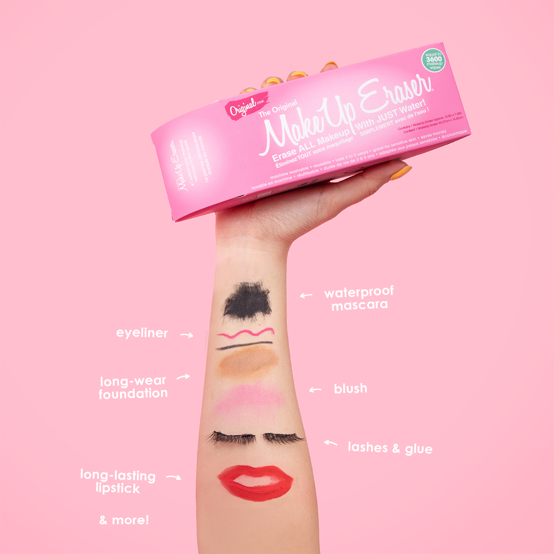 Hand holding Original Pink MakeUp Eraser packaging. There is writing on the arm that calls out the various makeup that MakeUp Eraser can remove.