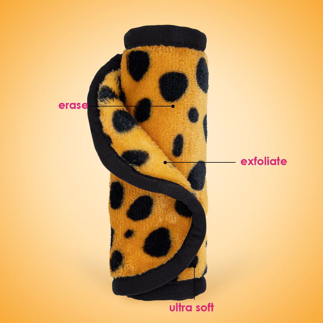 Rolled up Cheetah Print MakeUp Eraser with both sides exposed. The short fiber side is labeled as erase, and the long fiber side is labeled as exfoliate.