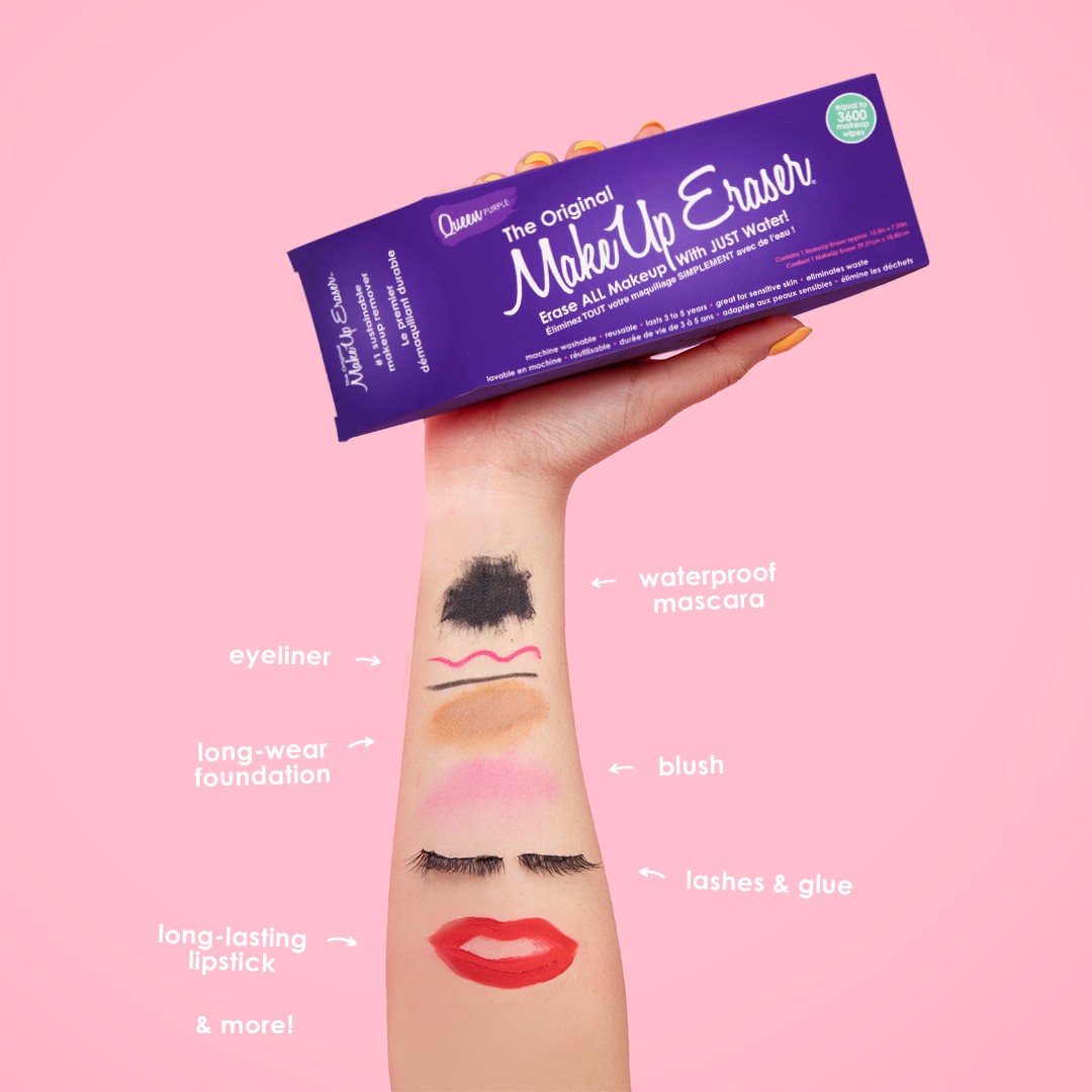 Hand holding Queen Purple MakeUp Eraser packaging. There is writing on the arm that calls out the various makeup that MakeUp Eraser can remove.