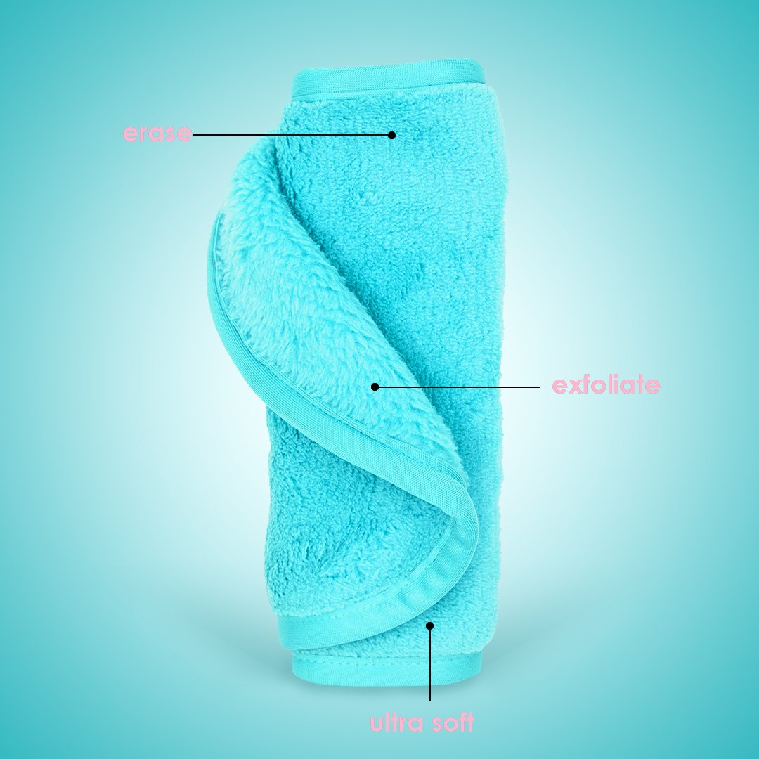 Rolled up Fresh Turquoise MakeUp Eraser with both sides exposed. The short fiber side is labeled as erase, and the long fiber side is labeled as exfoliate.